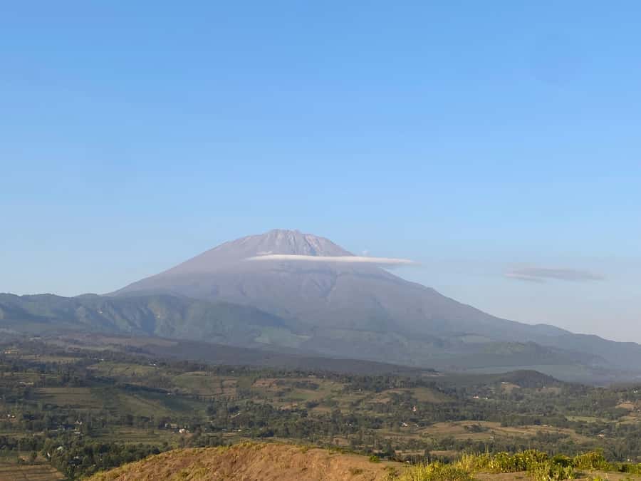 Arusha: Golden Hour Walk & Sunset Viewpoint Over Mount Meru - The climb to the hilltop crater