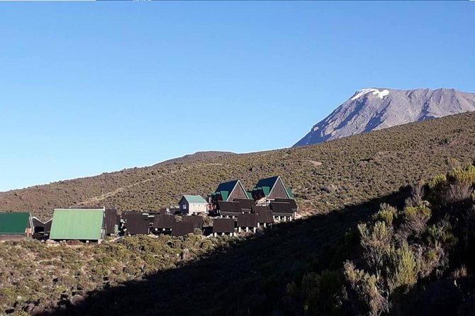 Conquer Kilimanjaro: 5-Day Marangu Route Adventure - Huts, meals, water, and the support crew