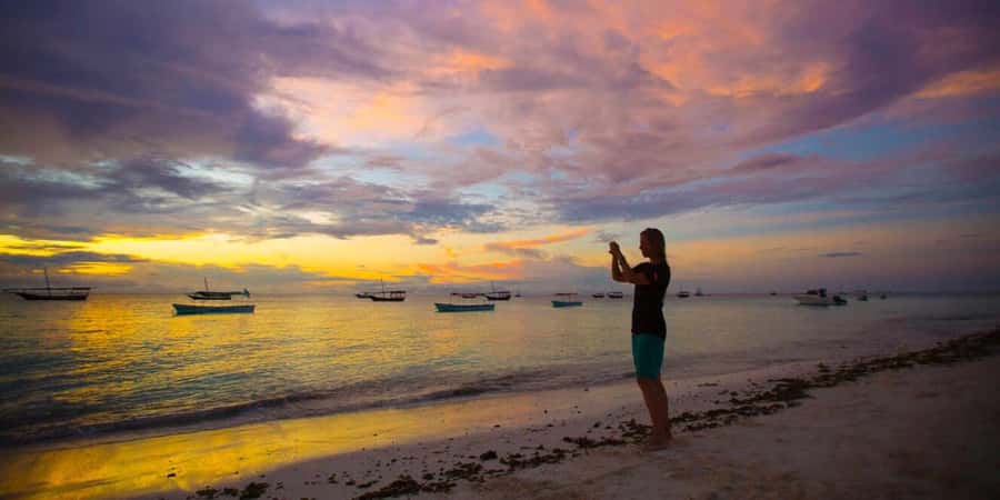 From Nungwi: Guided Sunset Dhow Cruise - Boarding the dhow is part of the adventure