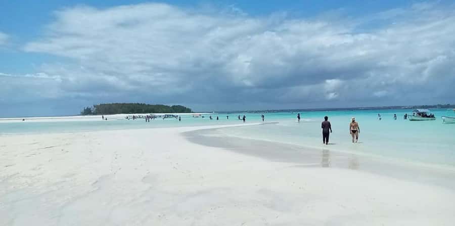 FROM NUNGWI; MNEMBA SNORKELING AND DOLPHIN TOUR - Taking a fruit break on the water
