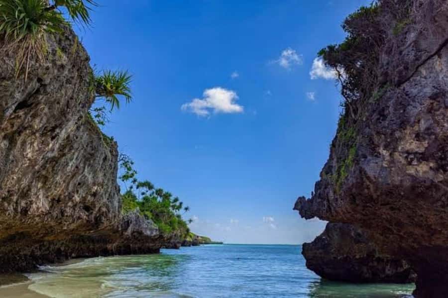 Kuza Cave, Hidden Mtende Beach & The Rock Restaurant - Entering Kuza Cave in Jambiani