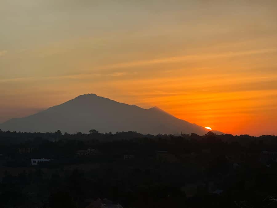 Moshi: Sunset Chill with Drinks and Roundtrip Transfer - A hilltop sunset with Kilimanjaro in the distance