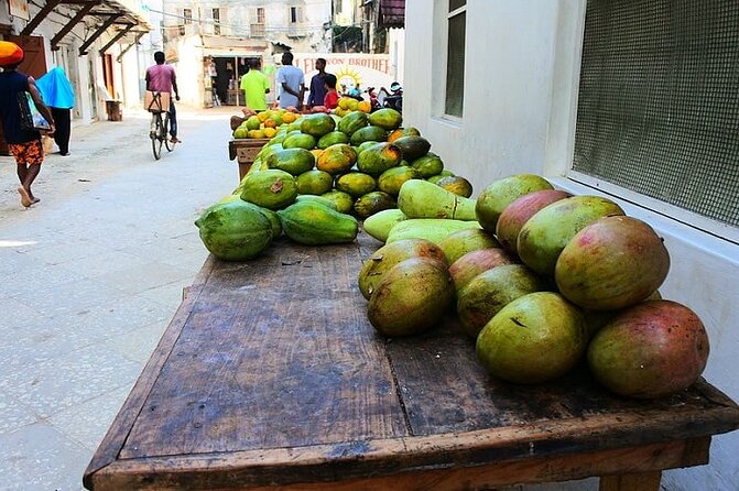 Stone Town Tour + Prison Island Tour in Zanzibar with Pick Up - The waterfront and the city’s difficult past