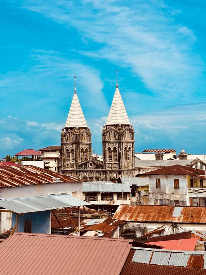 Stone Town Walking Tour With Local Expert Guide - Former Slave Market and Anglican Cathedral