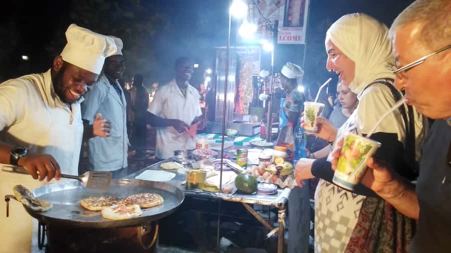 Stonetown: Food Markets and Street Food Walking Tour - Sunset, a rooftop view, and one included drink