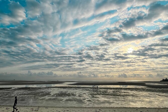 Sunrise Beach Walk with Picnic Breakfast Activity - Walking out across the exposed shore