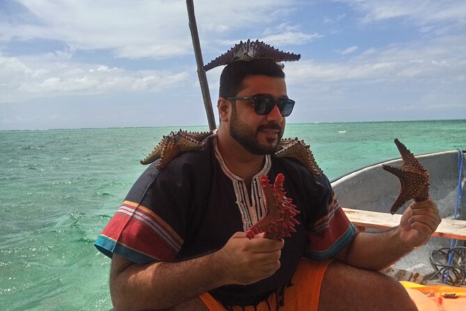 The Rock Restaurant & Blue Lagoon Half Day Tour in Zanzibar - Pickup, vehicles, guides, and group size