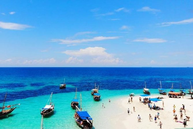 Zanzibar Dhow Cruise day adventure, sea sports at Kwale Island, very memorable - Sailing Zanzibar’s coast on a wooden dhow